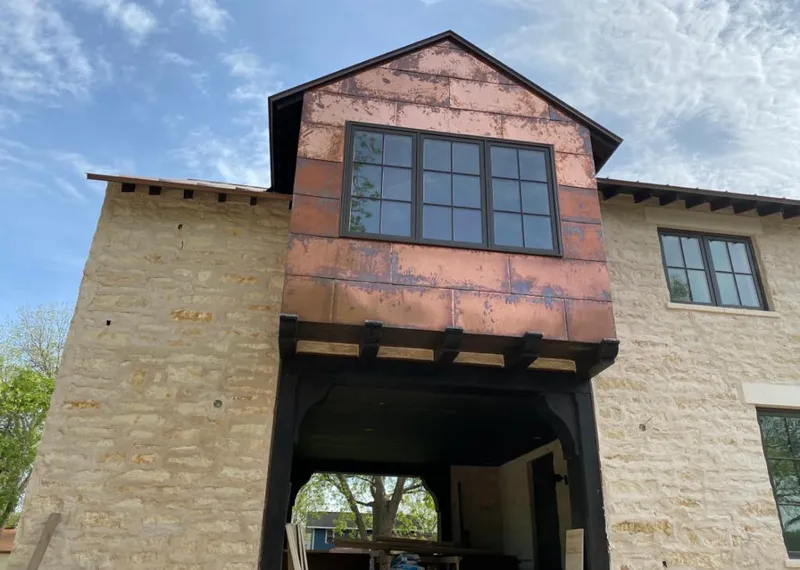 Copper metal panel facade on a stone building for Metal Roof Coating in Brookfield